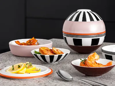Various dishes being served in the La petite Boule Memphis bowls Various dishes, including prawns and lemon slices, being served in the La petite Boule individual bowls.