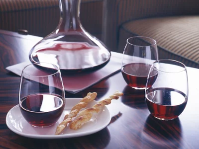 Entrée glasses with red wine Entrée glasses with red wine on table