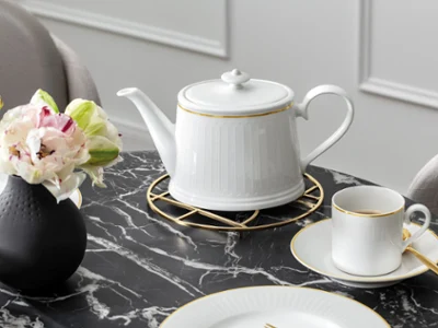 Elegant Chateau Septfontaines teapot next to a Manufacture stone vase on a stylish marble table with sophisticated décor