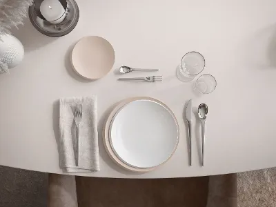 Una tavola apparecchiata con stoviglie, posate e utensili NewMoon in delicate tonalità beige.