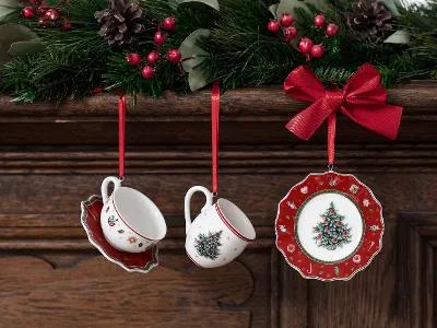 Toy's Delight ornaments hanging on red ribbons Toy's Delight ornaments hanging on red ribbons from a wooden mantelpiece decorated with mistletoe and berries.