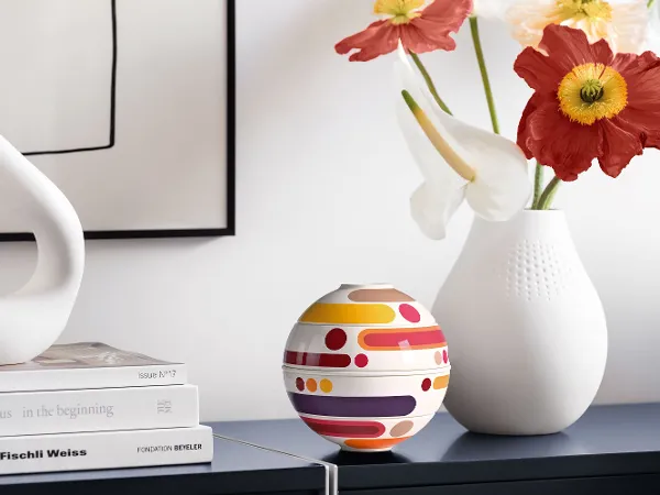 Iconic La petite Boule Miami with White Vase Arrangement Decorative arrangement with La petite Boule Miami and a white vase on a light sideboard.