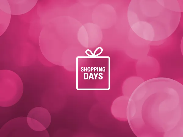 Arrière-plan bokeh rose avec un symbole de boîte cadeau blanc au centre et l'inscription « Shopping Days ».