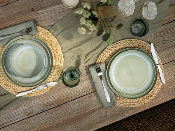 Aerial shot of Perlemor alga on rustic table setting paired with like glassware.