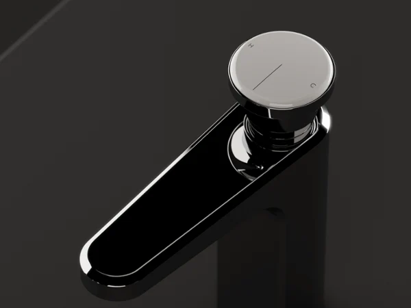 Gros plan d’une poignée de robinet moderne chromée sur fond sombre.