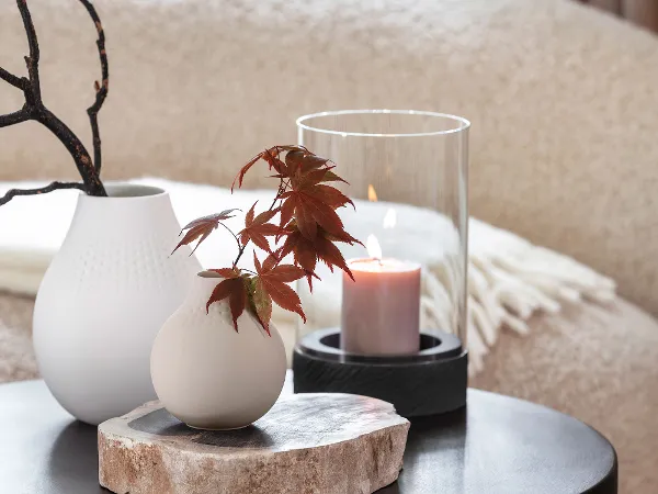 Lantern and Vase Arrangement with Collier Perle A balanced interior styling featuring a Rock Home lantern and several Manufacture Collier Perle vases arranged together.