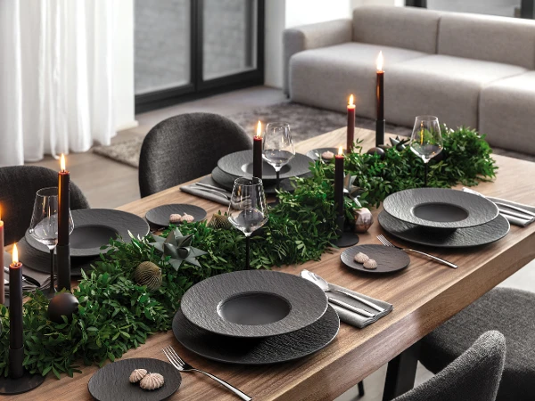 Manufacture Rock Christmas Tableset with Noir Candle Holder A modern holiday table setting featuring Rock Noir candle holders as elegant centerpieces.