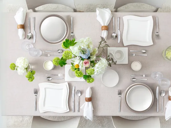 Modern NewWave table setting styled with NewMoon dinnerware for a contemporary dining look.