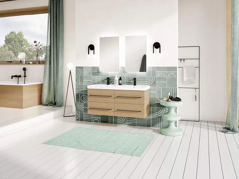 An Avento washbasin in a light-coloured bathroom with an illuminated mirror and vanity unit.