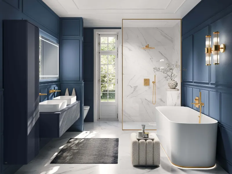 Vintage bathroom with a Villeroy & Boch Finion bath and a Collaro washbasin, blue wall panels and gold taps. A spacious shower with marble walls and the freestanding bath create a luxurious ambience in a classic style.