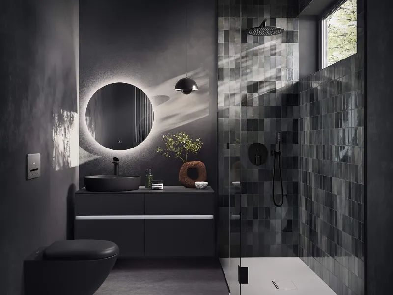Kleines schwarzes Badezimmer mit Antao Aufsatzwaschbecken Modernes Badezimmer mit dunklen Fliesen, einem runden Spiegel, einem schwebenden Waschbecken und einer verglasten Dusche mit Tageslicht.