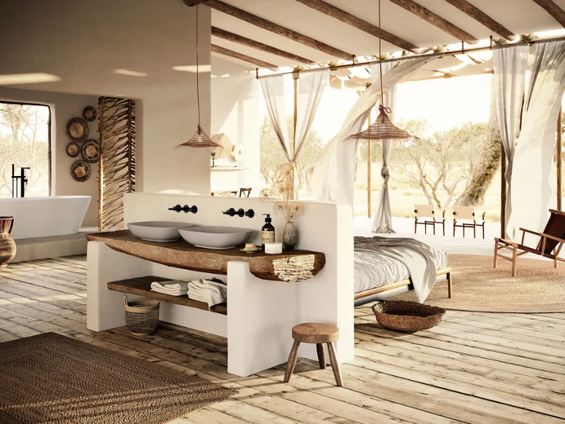 Bathroom with double washbasin, bed, and natural light. Open bathroom and bedroom with Loop&Friends design, inspired by Tanzania’s natural tones and crafted details.