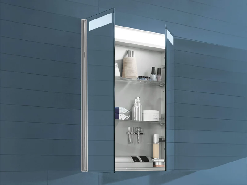 My View 14 mirrored cabinet with open doors Wall-mounted bathroom cabinet with open mirrored door, containing shelves with toiletries and personal care items.