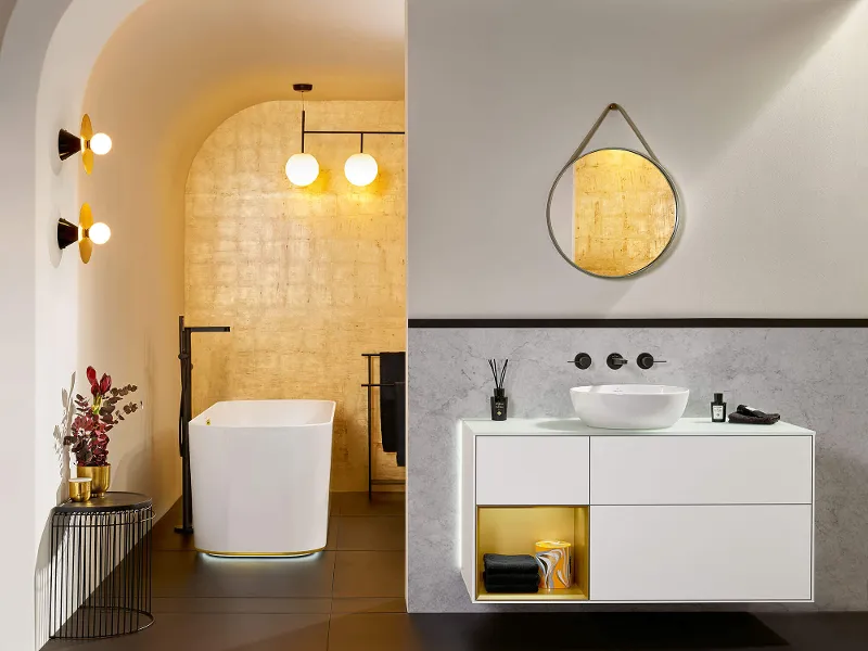 White Artis surface-mounted washbasin with a Conum tap and Finion bath and furniture.