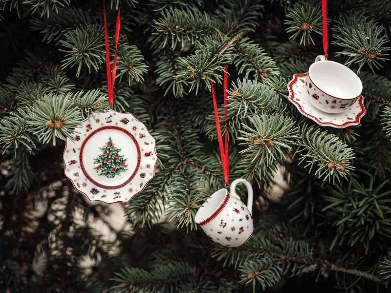 Toy's Delight ornaments with festive patterns hanging on a Christmas tree as decoration.