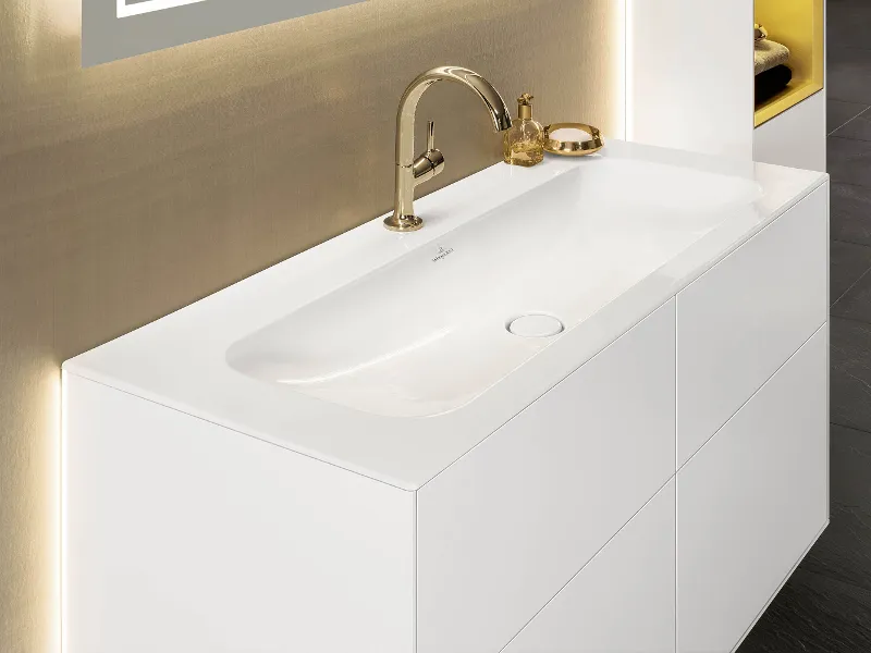 White Finion vanity washbasin with base unit and lighting.