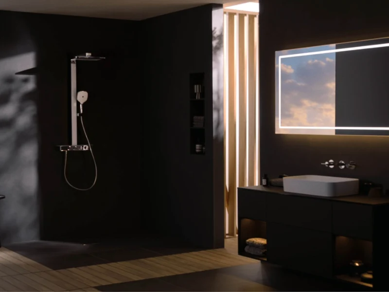 Infinity Showers shower system tap Close-up of three round chrome knobs on a modern shower control panel.