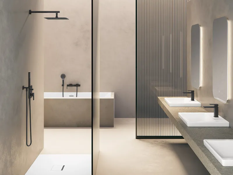 A minimalist bathroom with a walk-in shower, a freestanding bath, three washbasins with mirrors and modern taps. The design features neutral colours and clear lines.