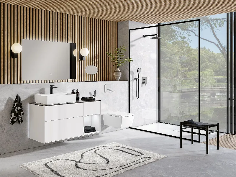 A modern bathroom with modern wooden ceilings and a white Memento 2.0 washbasin and toilet.