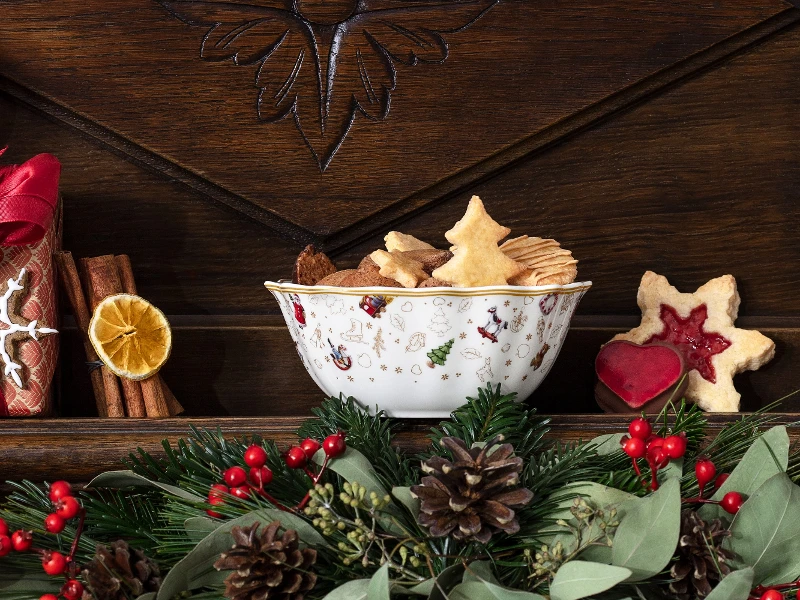 Toys Delight anniversary bowl with cookies placed on a Christmas themed mantel. 
