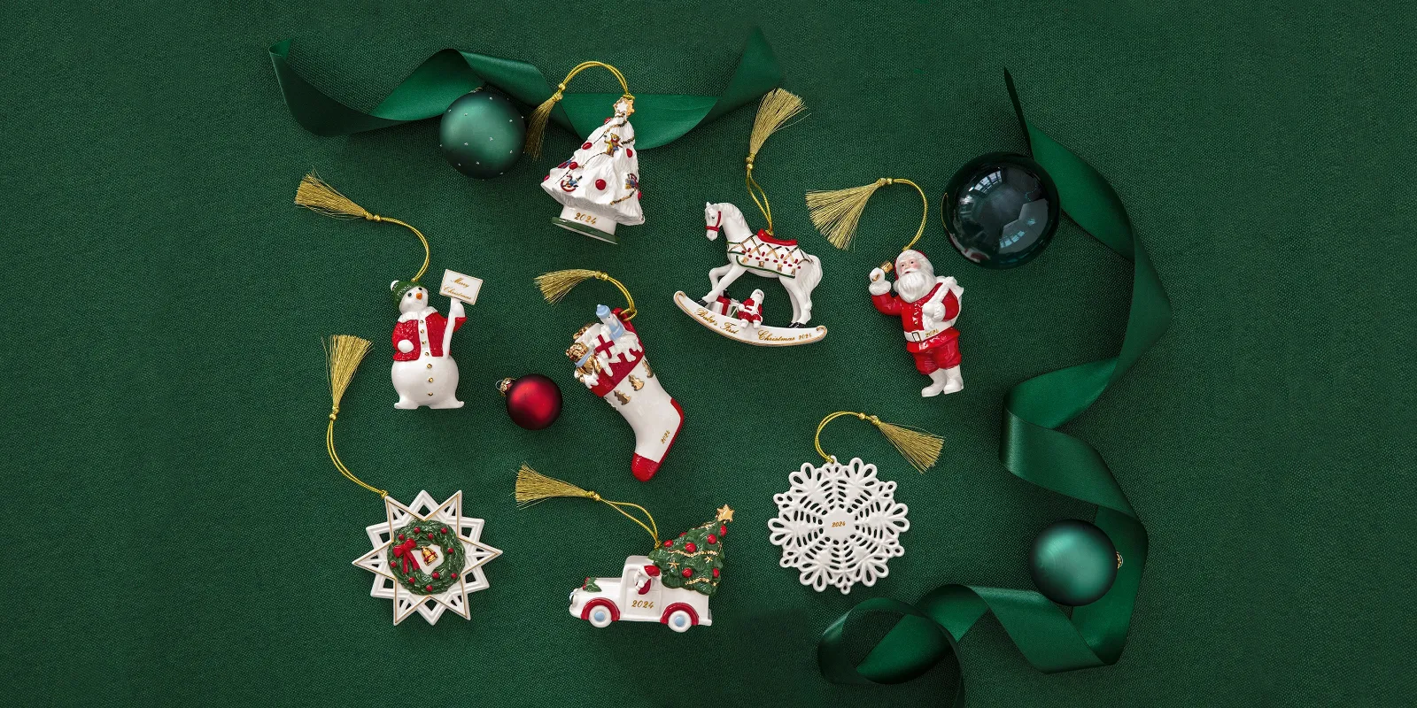 Annual Christmas Edition Christmas decoration 2024 with a Santa Claus, a snowflake, and a rocking horse on a green background with green ribbon and ball-shaped decorations.