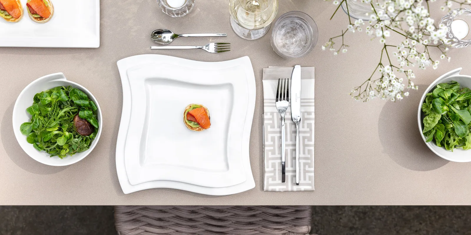 A table set with NewWave plates and cutlery from Villeroy & Boch.