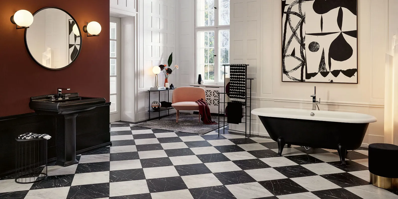 A bathroom with a black and white chequered floor and a black Hommage bath by Villeroy & Boch.