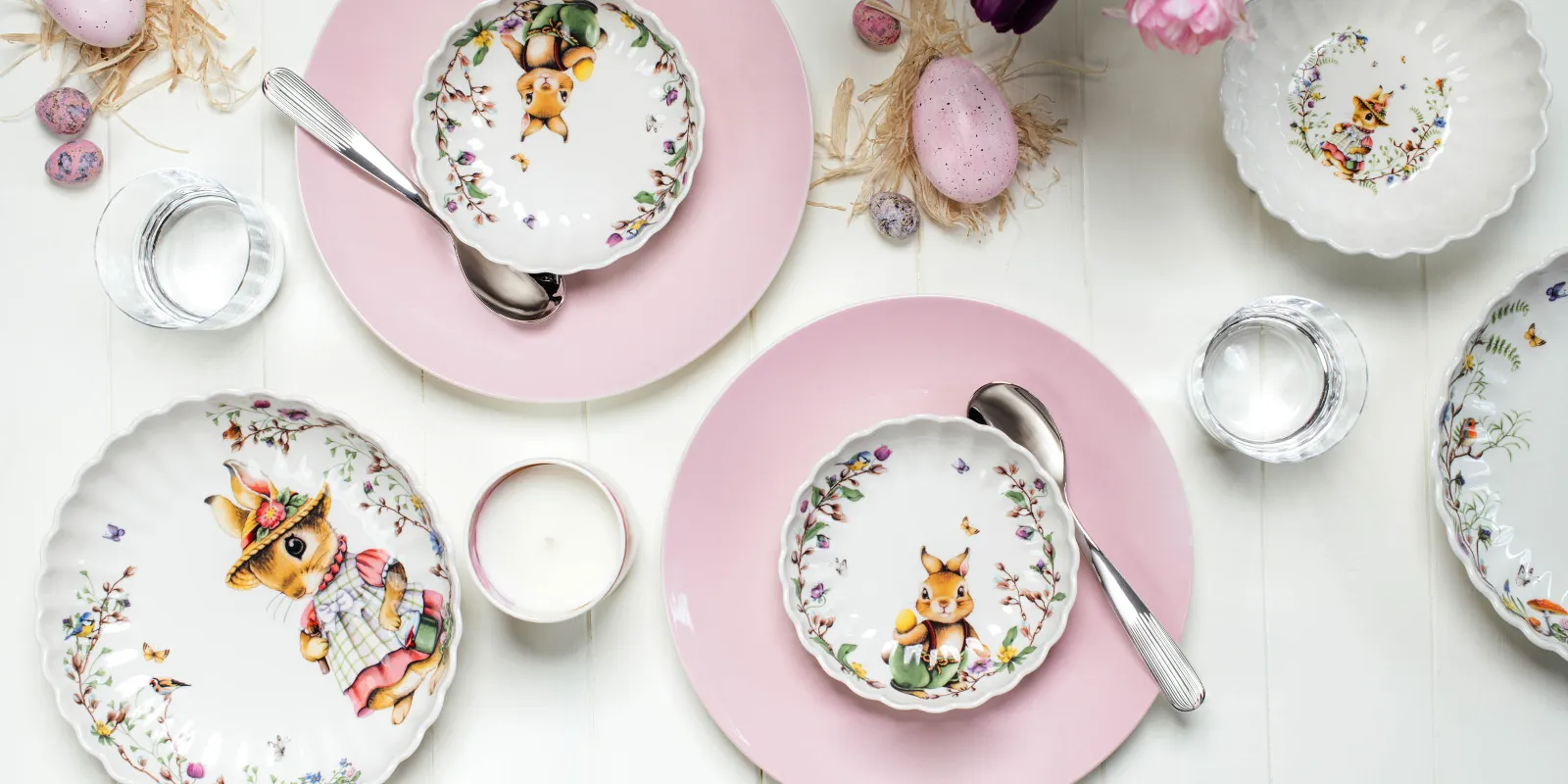 Easter-themed table decorations with decorated Spring Fantasy plates and Rose Garden plates as coasters and flower arrangements.