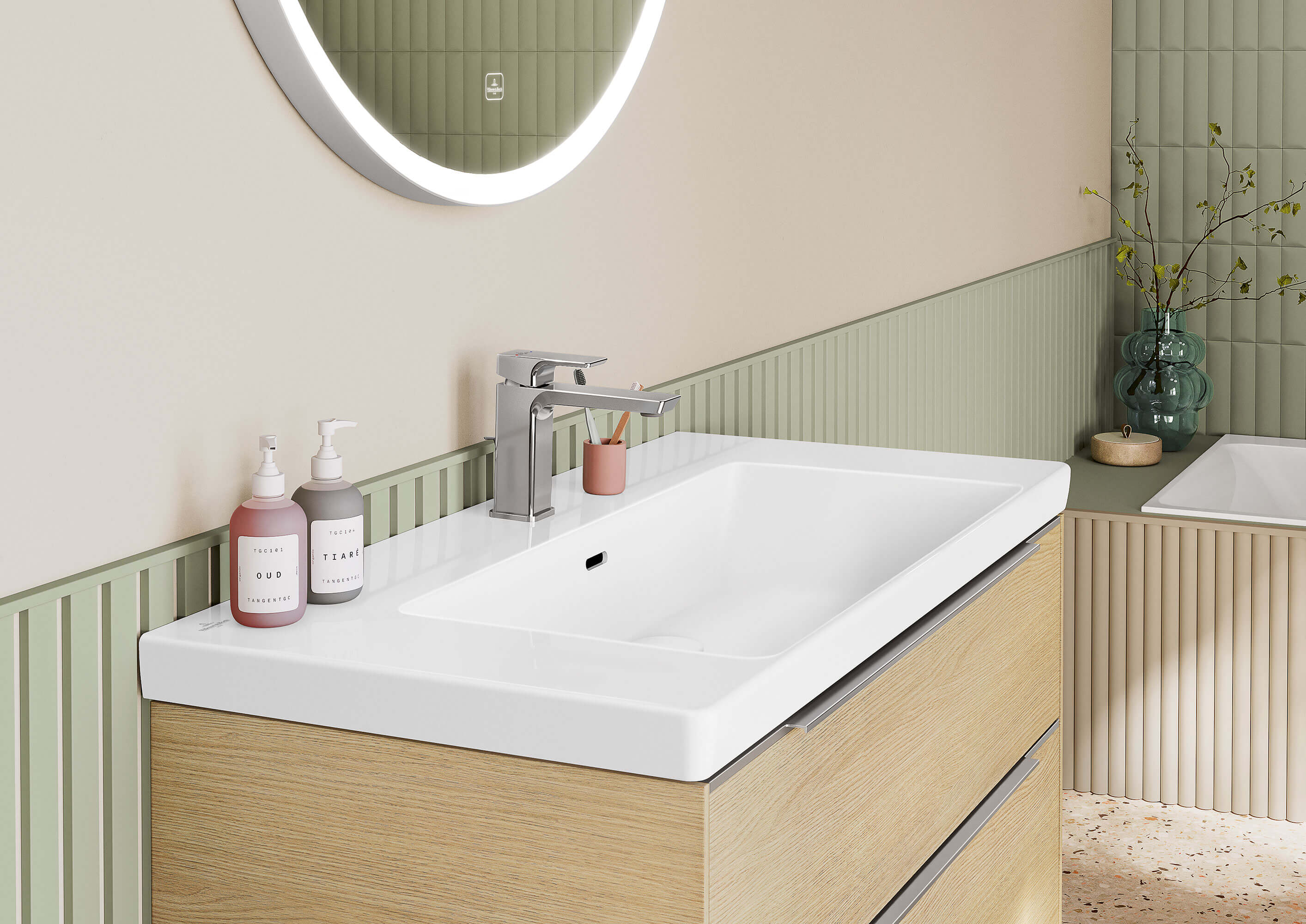 A white Subway 3.0 vanity washbasin in a bathroom with green walls.