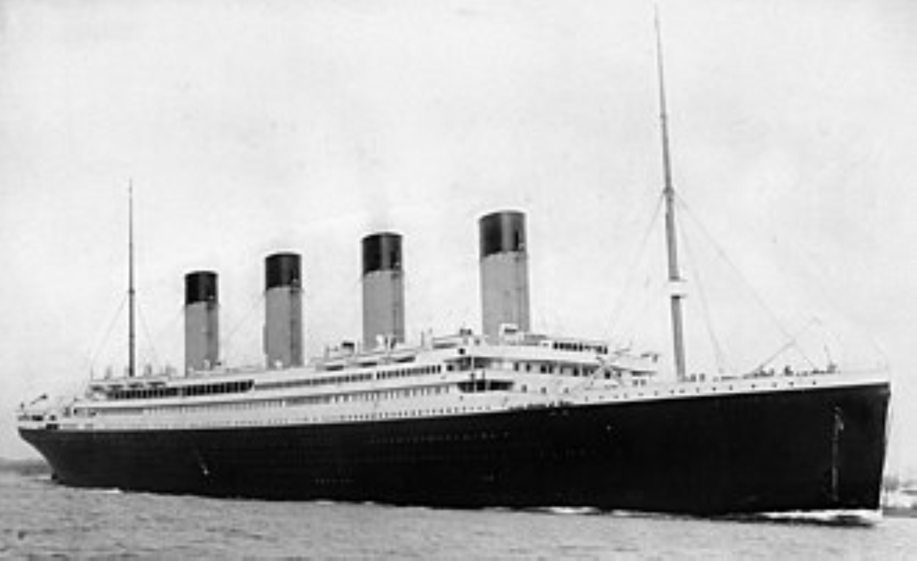 vb-history-titanic A large ocean liner with four funnels and sails, depicted in black and white, representing The Titanic